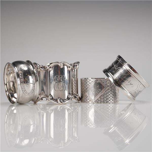 A Collection of Four Sterling Silver Napkin Rings