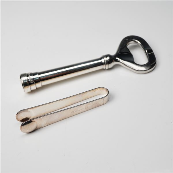 A Pair of Christofle Silver Plate Bottle Opener and Tongs