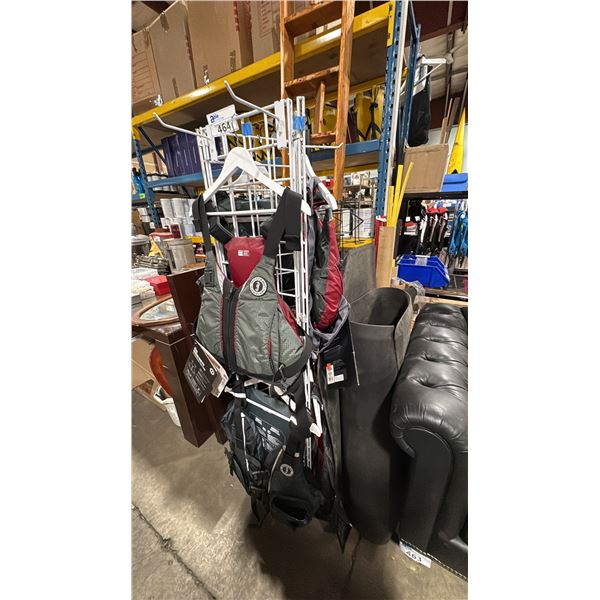 WHITE COMMERCIAL DISPLAY RACK WITH 6 ASSORTED SIZE MUSTANG SURVIVAL FOAM LIFE JACKETS