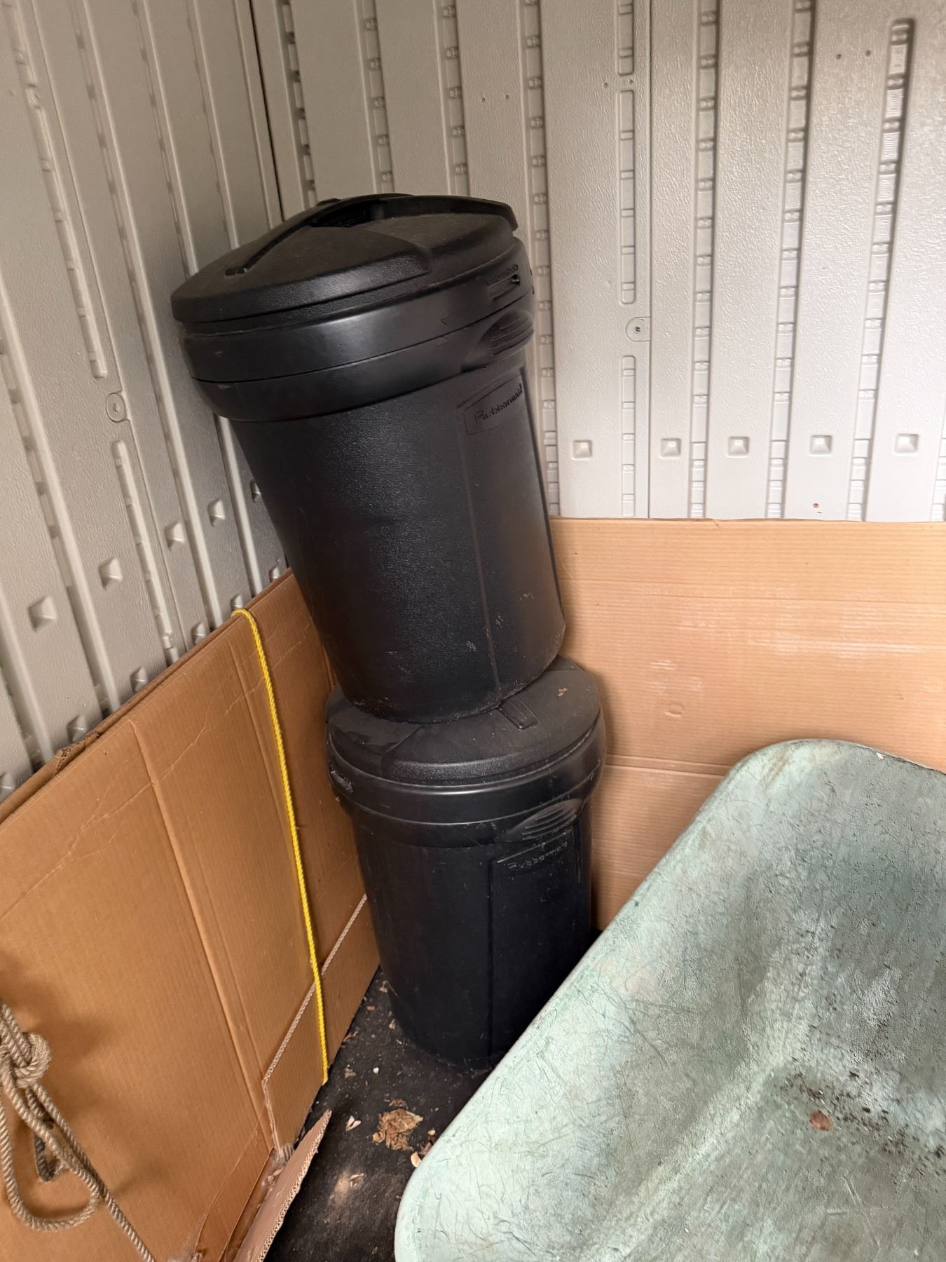 2 Rubbermaid, garbage cans