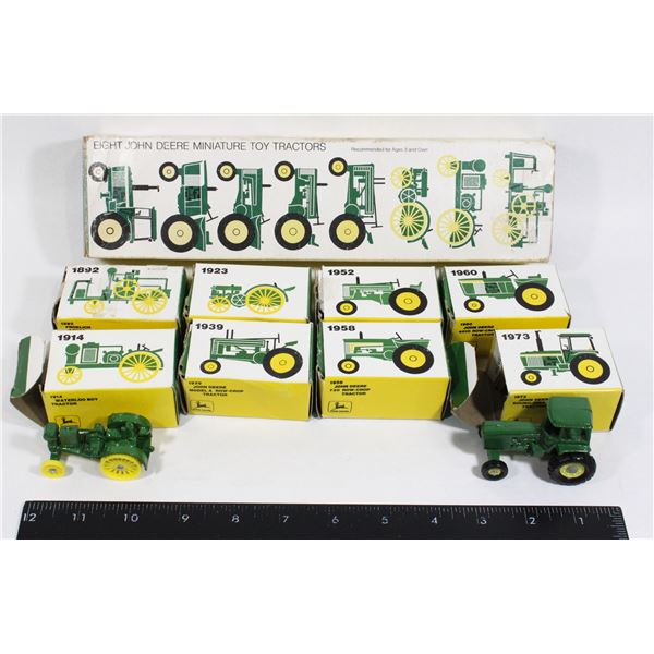 #713 Eight John Deere Miniature Toy Tractors Boxed