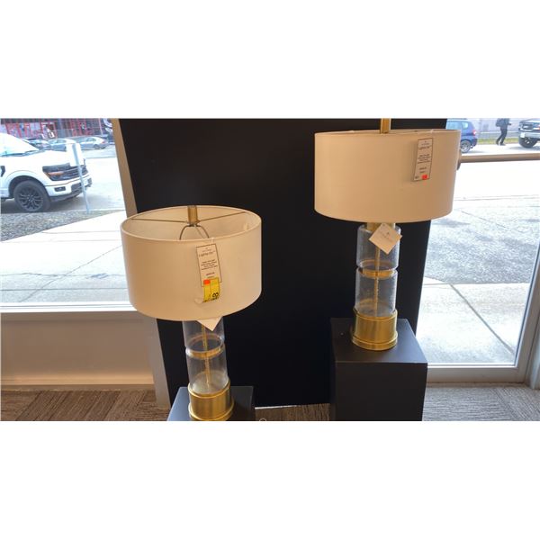 PAIR OF UTTERMOST VAIGA SINGLE LIGHT TABLE LAMPS. ANTIQUE BRASS, ROUND HARD BACK DRUM GLASS.