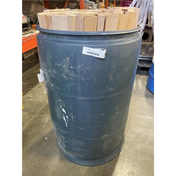METAL BARRELL FULL OF HEMLOCK WOOD PIECES, 1" X 2" X 38"