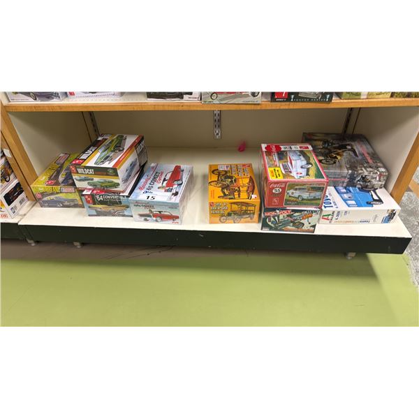SHELF OF ASSORTED MODEL CARS INCLUDING; AMI 1964 CONVERTIBLE CUSTOMIZING KIT, AMI 1923 T DEPOT HACK,
