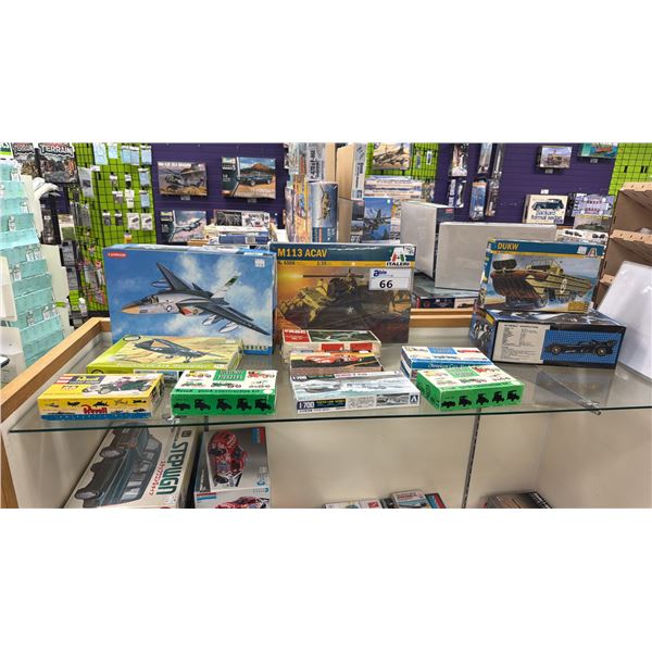 SHELF OF ASSORTED MODEL VEHICLE KITS INCLUDING; M113 ACAV, REVELL HIGHWAY PIONEERS, MASERATI 5000 GT