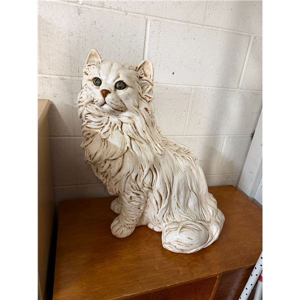 Pottery cat decor measures 21 1/2 inches tall