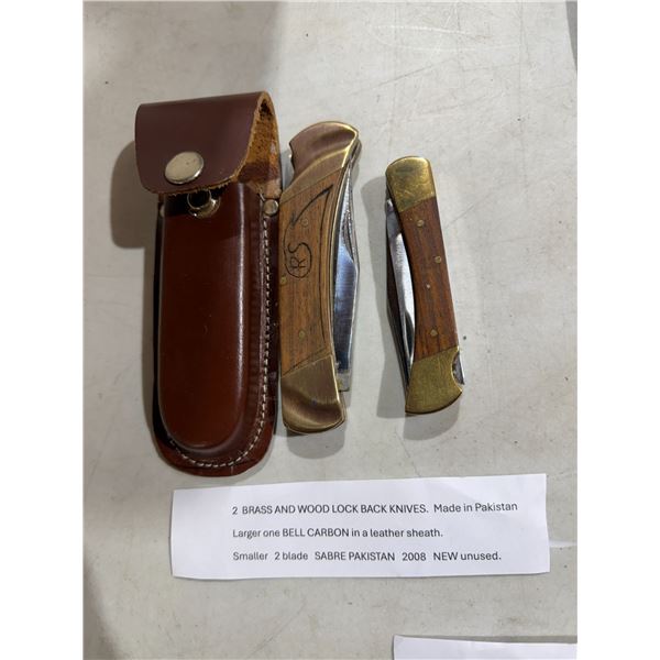 Two brass and wood lock blade knives
