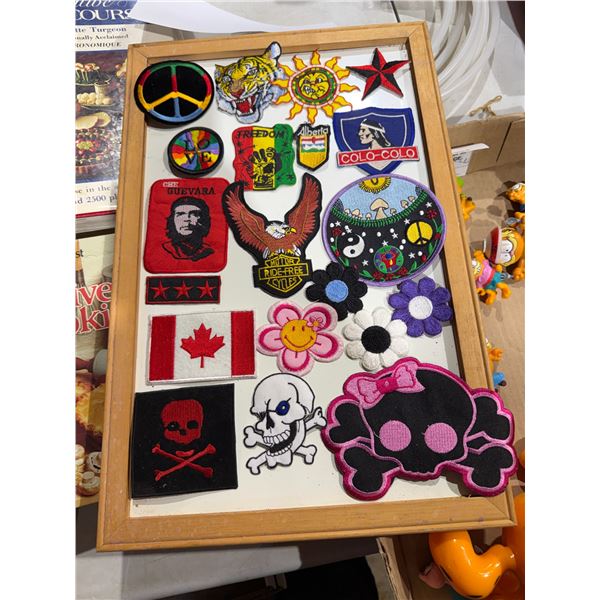 Assorted patches on a wood framed whiteboard