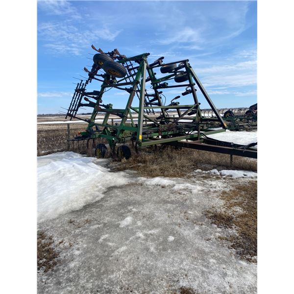 JD 1610 35 ft. Deep Tillage, c/w 4 bar tine harrows, shanks seem tight, hyd. ram included, no serial
