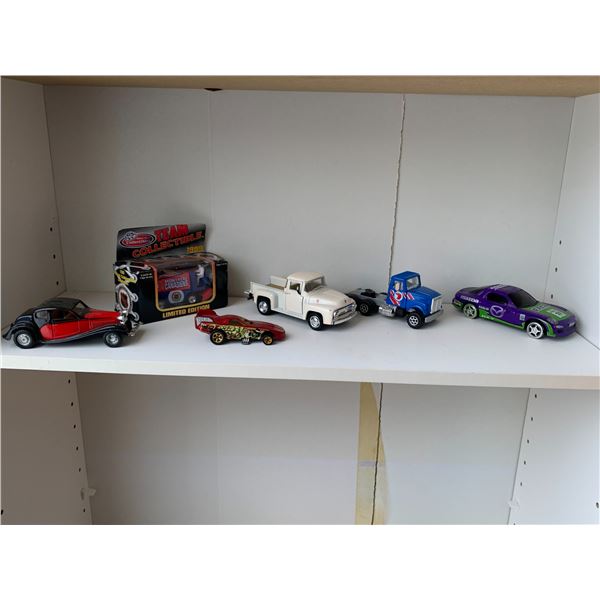 6- Various toy cars & trucks (Red bug, Montreal collectable race car, white ford truck etc.)
