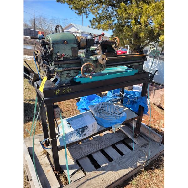 Logan Engine Lathe, 11 x 24 inch c/w gears, chuck wrench, live center in tail