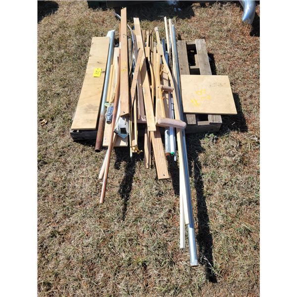 Pallet of misc. edging, pool cue & misc. wood