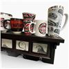 Image 4 : Wall Shelf with Assorted First Nations Design Cups, Mugs and Trucker Hats (Shelf is 23" long)