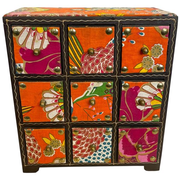 Accent Chest Featuring Nine Small Drawers with a Vibrant, Multicolored Floral & Patterned Design.