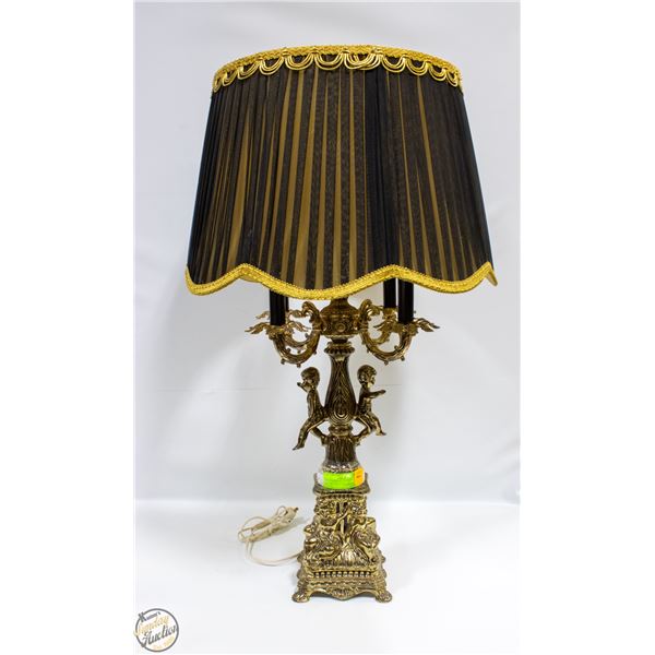 VINTAGE BRASS LAMP WITH CHERUBS IN CANDLE STICK