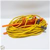 Image 1 : YELLOW EXTENTION CORD ON PLASTIC CORD STORAGE