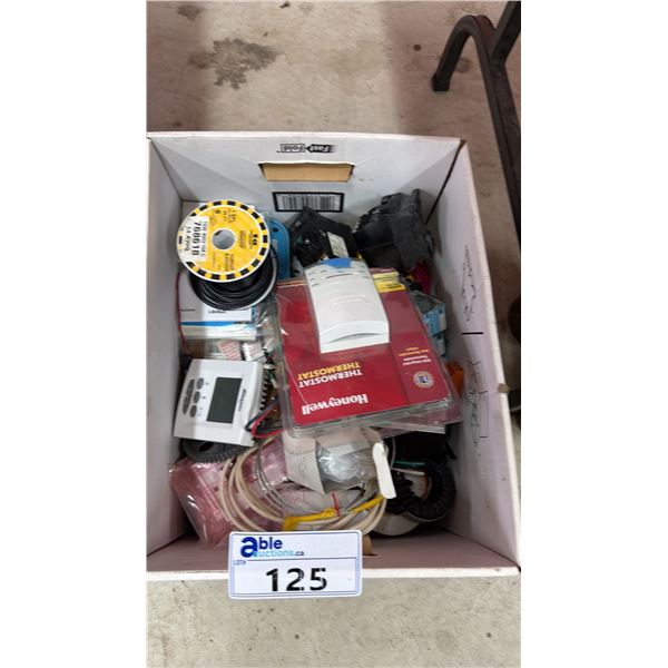 BOX OF ASSORTED ITEMS INCLUDING; HONEYWELL THERMOSTAT, 15 AMP CIRCUIT BREAKERS, TECHSPAN WIRE & MORE