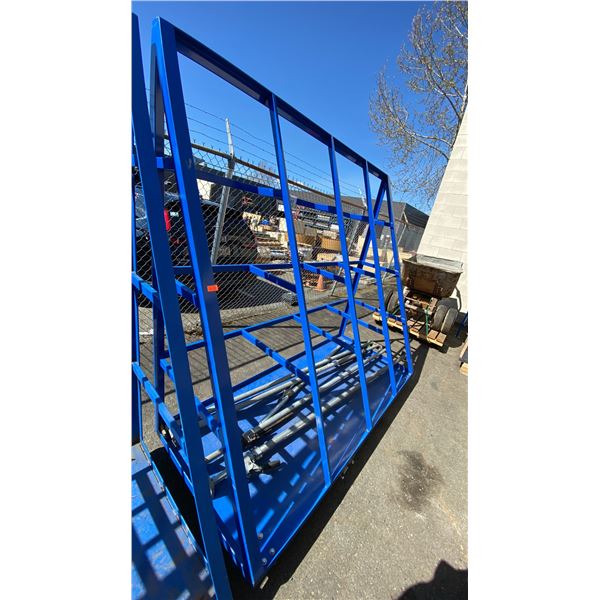 BLUE MOBILE ANGLED INDUSTRIAL MATERIAL RACK APPROX 7'L X 3'D X 6' 7"H WITH 5 METAL LOAD BARS
