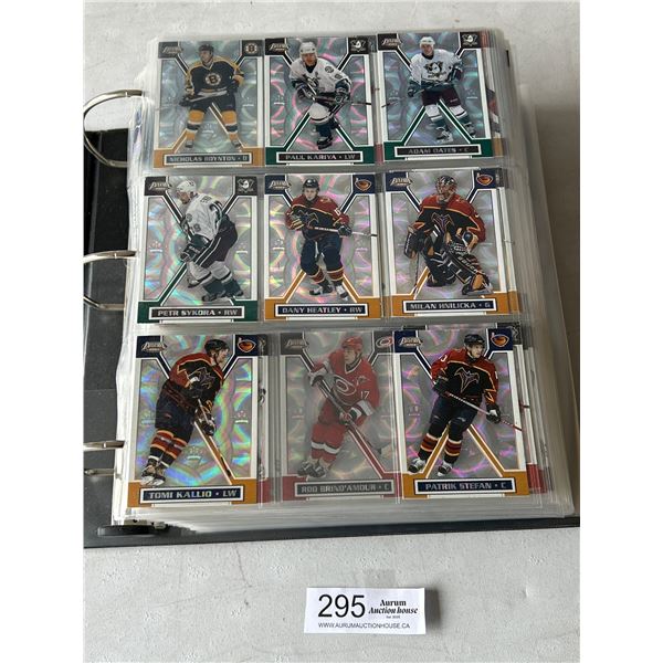 Binder lot of 2002 Pacific Exclusive plus other hockey Cards
