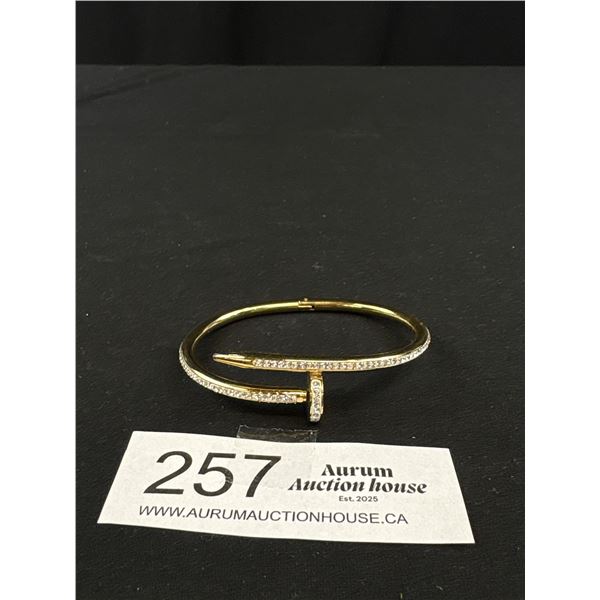 Gold w/ Tiny Stones Bangle, Marked Cartier, Oval Shaped, 2 1/2 x 2" Diam.