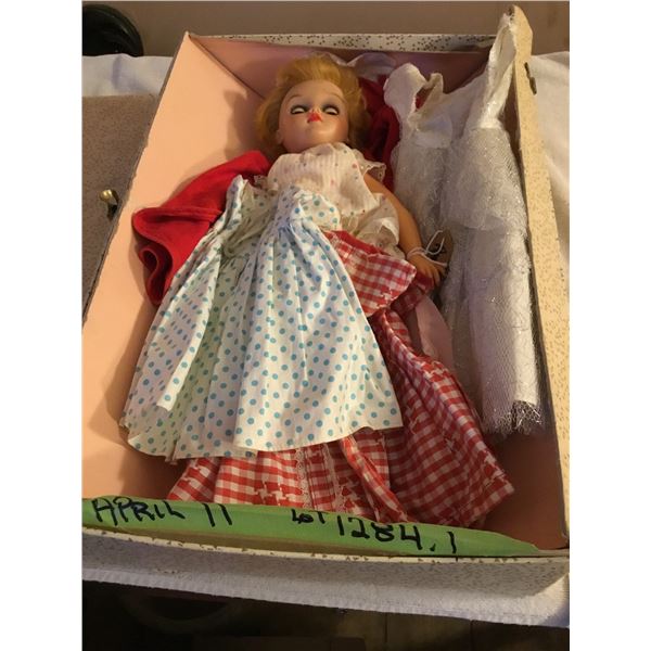 Vintage doll with dresses in good condition