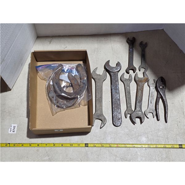 Vintage wrenchs and horse shoes