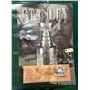 Image 1 : 1996 Kellogg’s Stanley Cup poster (34” x 22”) and 2007 Roughrider Grey Cu