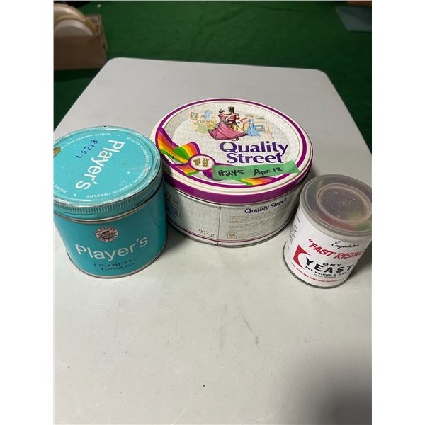 Tobacco, yeast and chocolate tins filled with game pieces and fridge magnets