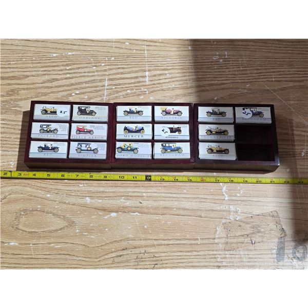 3 sets of small collector cars in holders