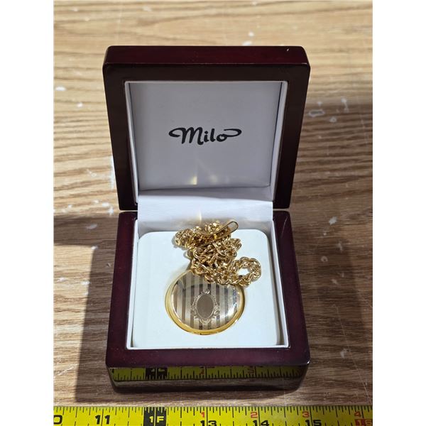New milo gold tone, quartz pocket watch with case