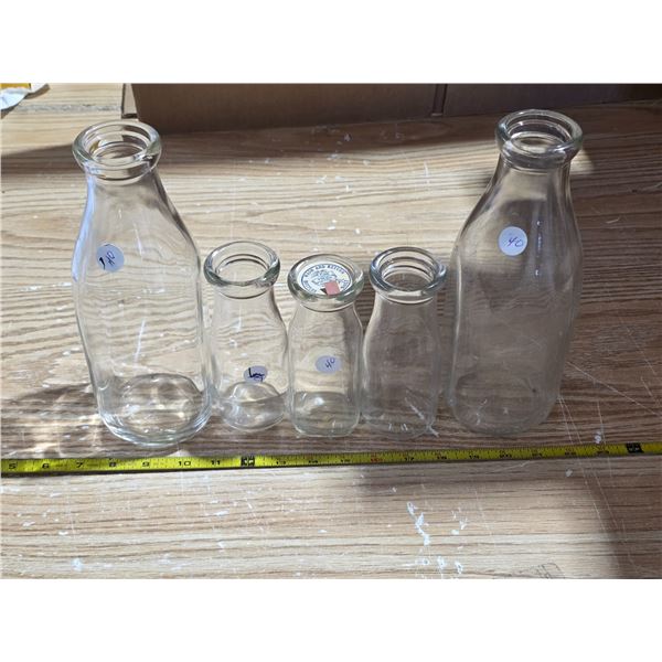 5 glass milk bottles- 1 quart and 1 pint bottles