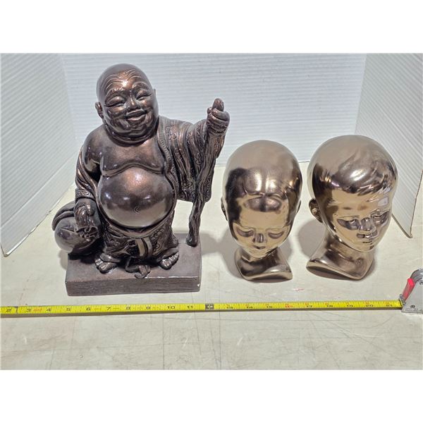 Buda statue and 2 head statues