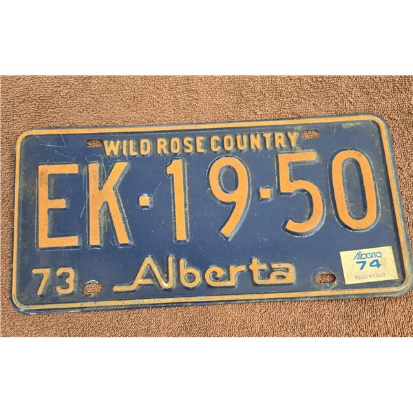 1099 - 1973 Alberta licence plate. Wild Rose Country