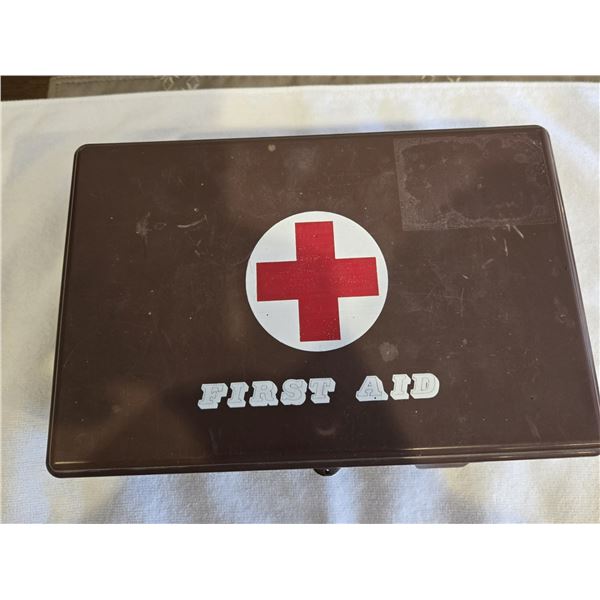 1108 - Vintage brown plastic first aid kit. 1970s or 1980s. Bandaids and wound dressings inside.  Ke