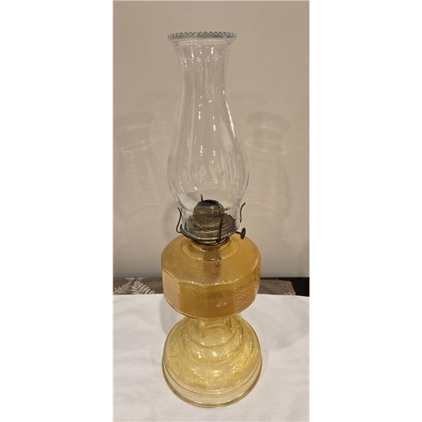 1109 - Vintage amber floral glass kerosene lamp with chimney.  18 1/2" tall. No chips or cracks.