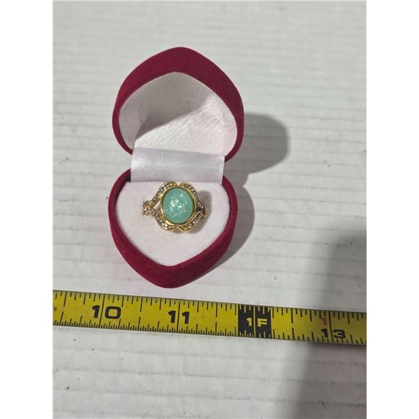 Gold colored ring with stone- size 7