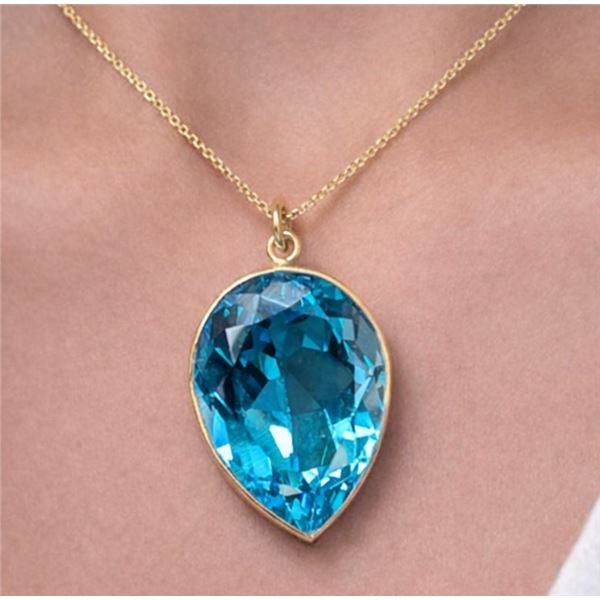 10k (2.4g), Blue Topaz (11ct) Pendant