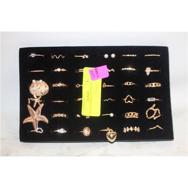 TRAY W/32 GOLDTONE RINGS