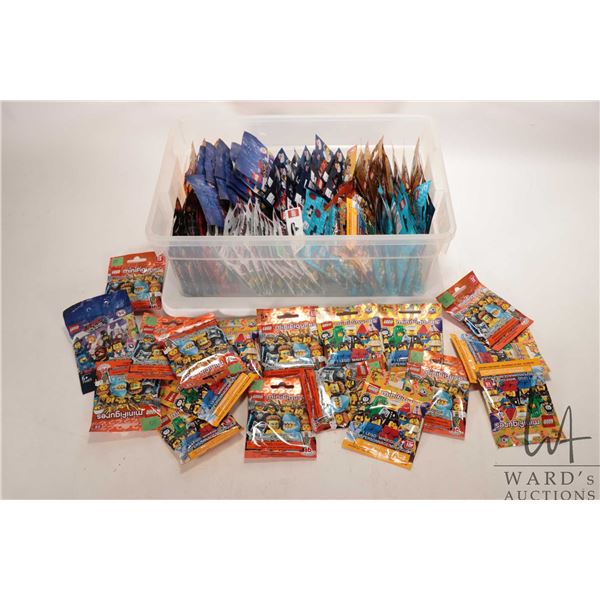 Tub containing 100 count of new in package Lego Minifigures, assorted series including some but not 
