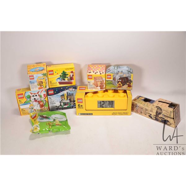 Eight Lego kits and a Lego alarm clock, all factory sealed, various themes