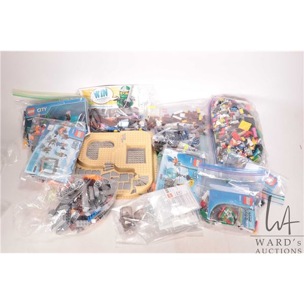 Box of assorted Lego bricks, Minifigures, accessories and bases