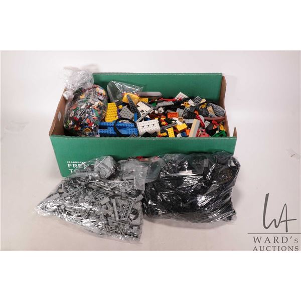Box of bagged and loose Lego bricks, Minifigures and accessories