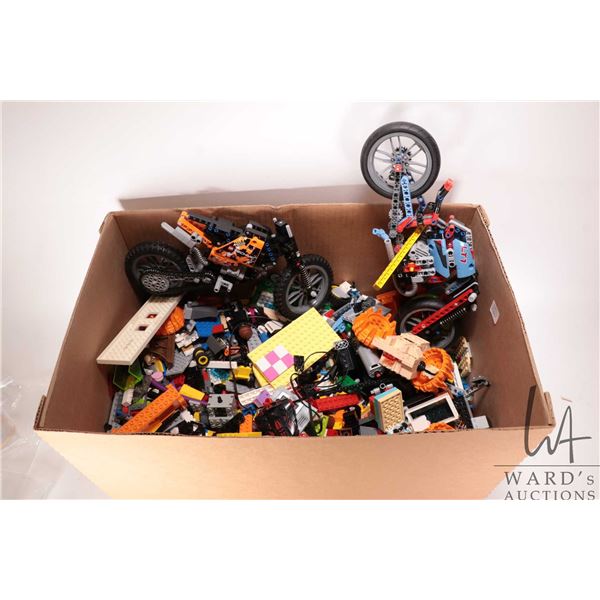 Box containing a large selection of loose Lego bricks and accessories