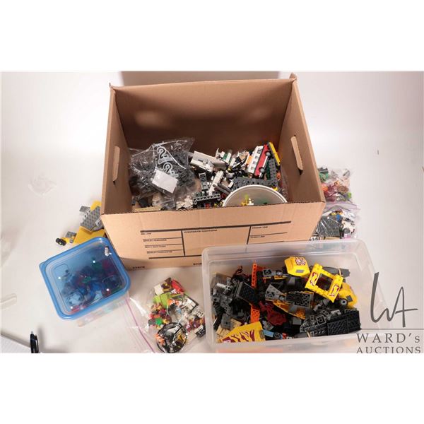 Box of pre-built Lego kits and loose Lego bricks and Minifigures etc.
