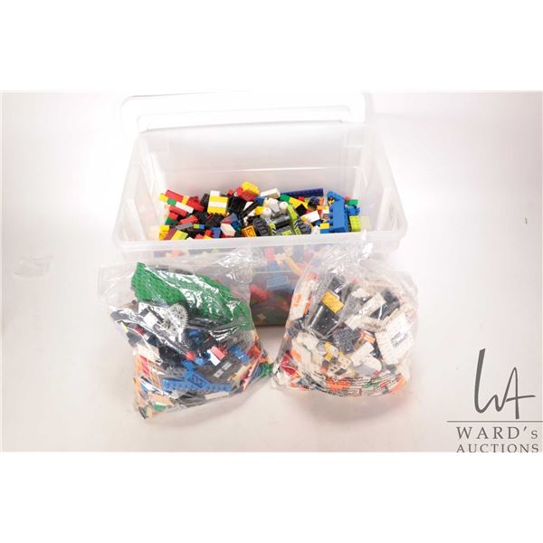 Tub containing a large selection of Lego bricks and accessories