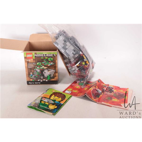 Two Lego "Minecraft" pre-built kits including no. 21102 Micro World with manual and box and a bag co