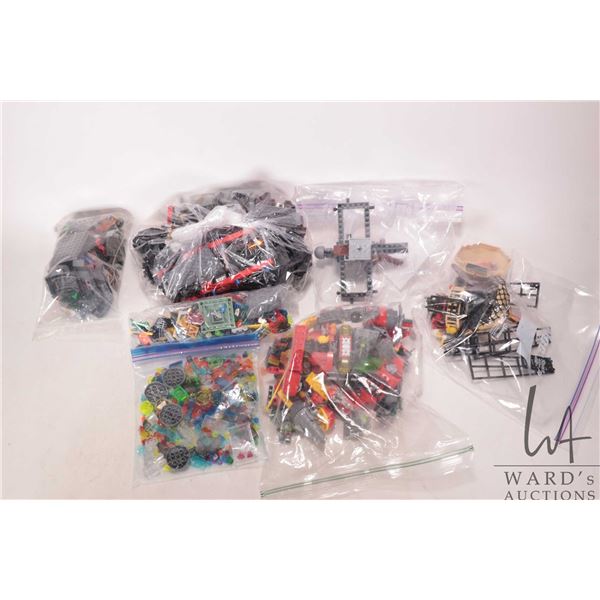 Selection of assorted Lego building bricks, some partially assembled kits. Bid accordingly