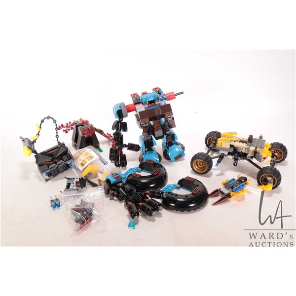 Assortment of Lego building kits and vehicles, appear to be from Lion Attack kit no. 70002 and Gorza