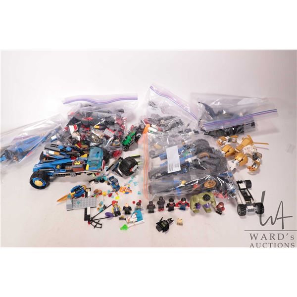 Box of Lego building bricks and partially assembled kits, includes some Minifigures. Completeness no