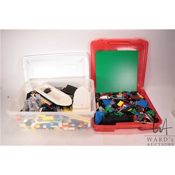 Selection of loose Lego building bricks and accessories in Lego case and plastic tote